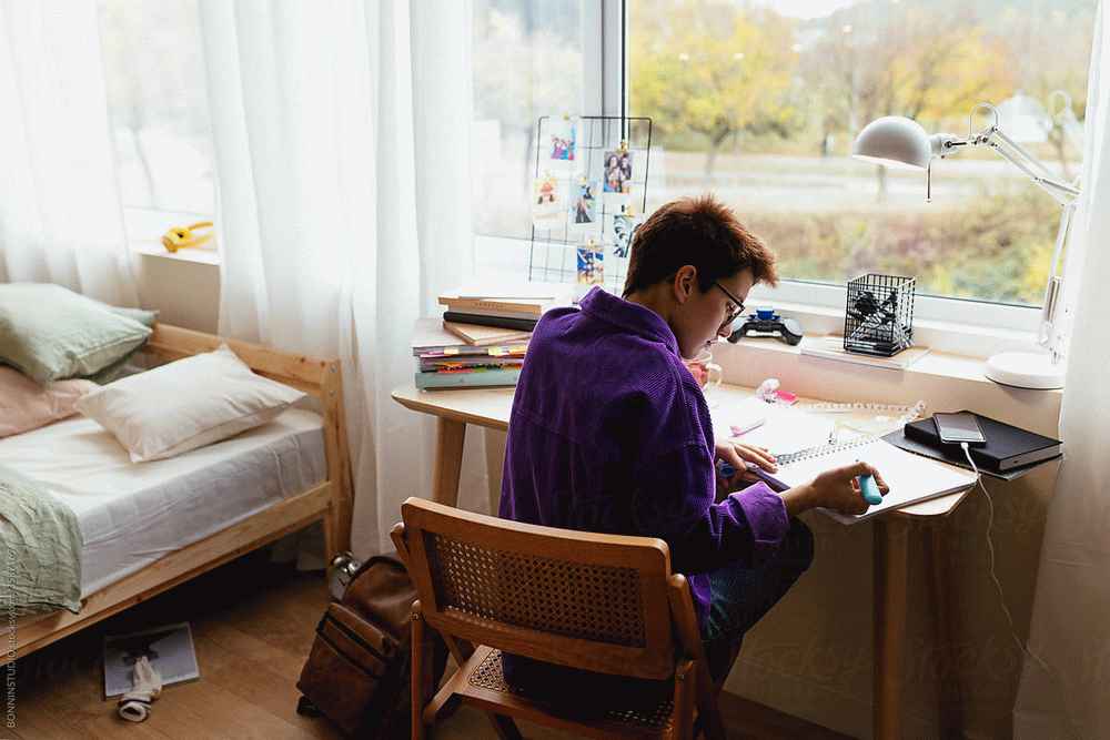 Download Picture description: Doing homework. B1